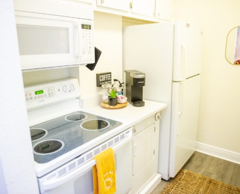 Kitchen with stove and refrigerator